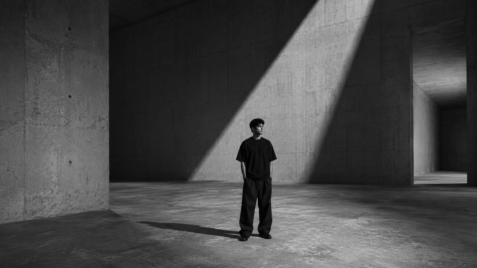 KRODH editorial — oversized streetwear in a brutalist interior